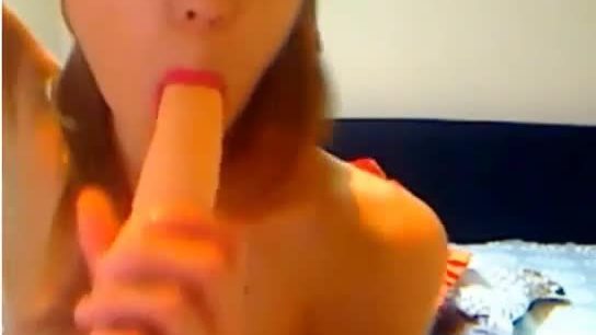 Teen fucking her ass with red dildo