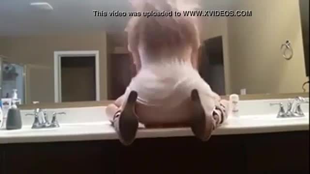 Crazy slut talking dirty in the bathroom mirror while stripping - plenty more at poontangclan.us