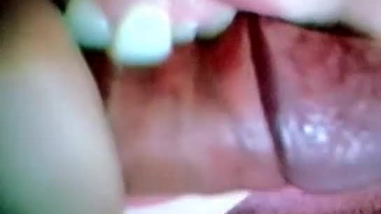 Shark-teeth girl bites and chews a cock